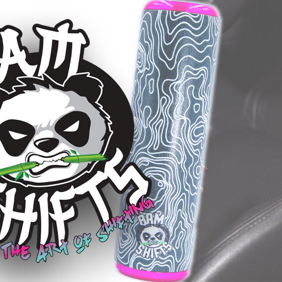 Two shift knobs of different sizes next to each other. Anime Themed.