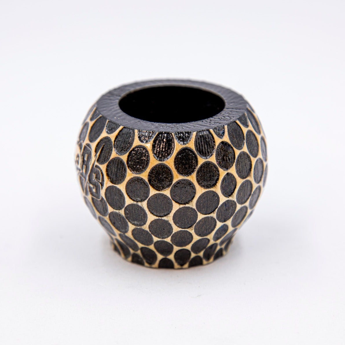 Black textured vase on a white background