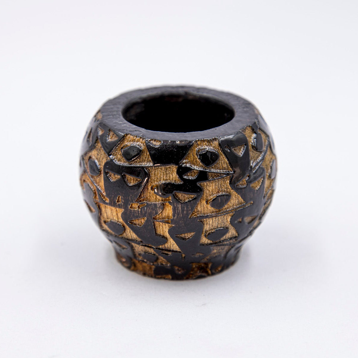 Decorative ceramic pot with a unique pattern on a white background