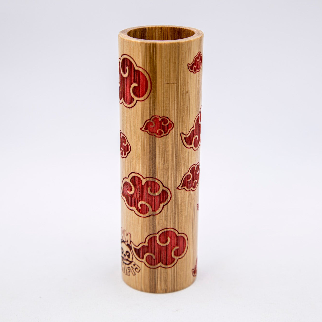 Bamboo cylindrical container with red cloud patterns on a white background