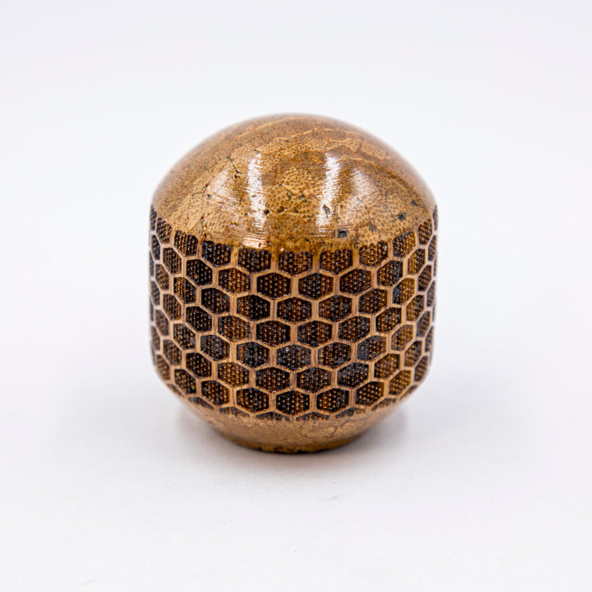 Brown textured ball on a white background