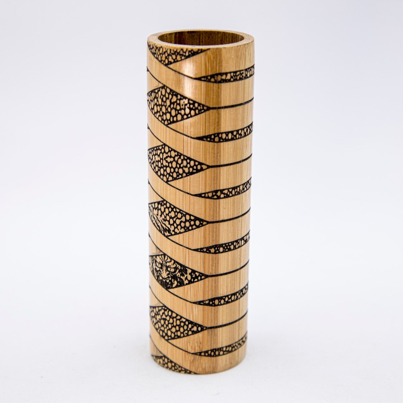 Bamboo vase with black geometric pattern on a white background