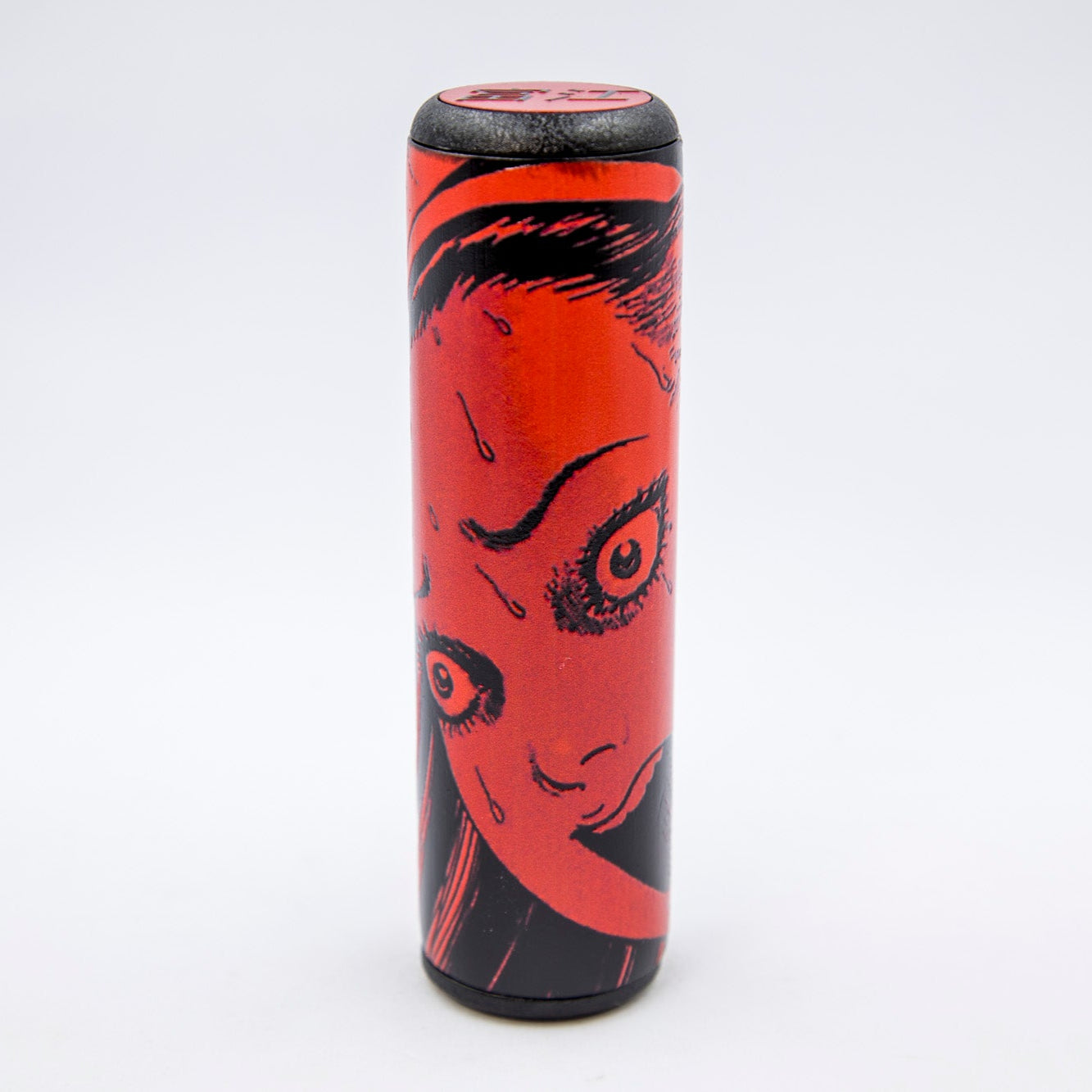 Cylindrical shift knob with red and black design on a white background